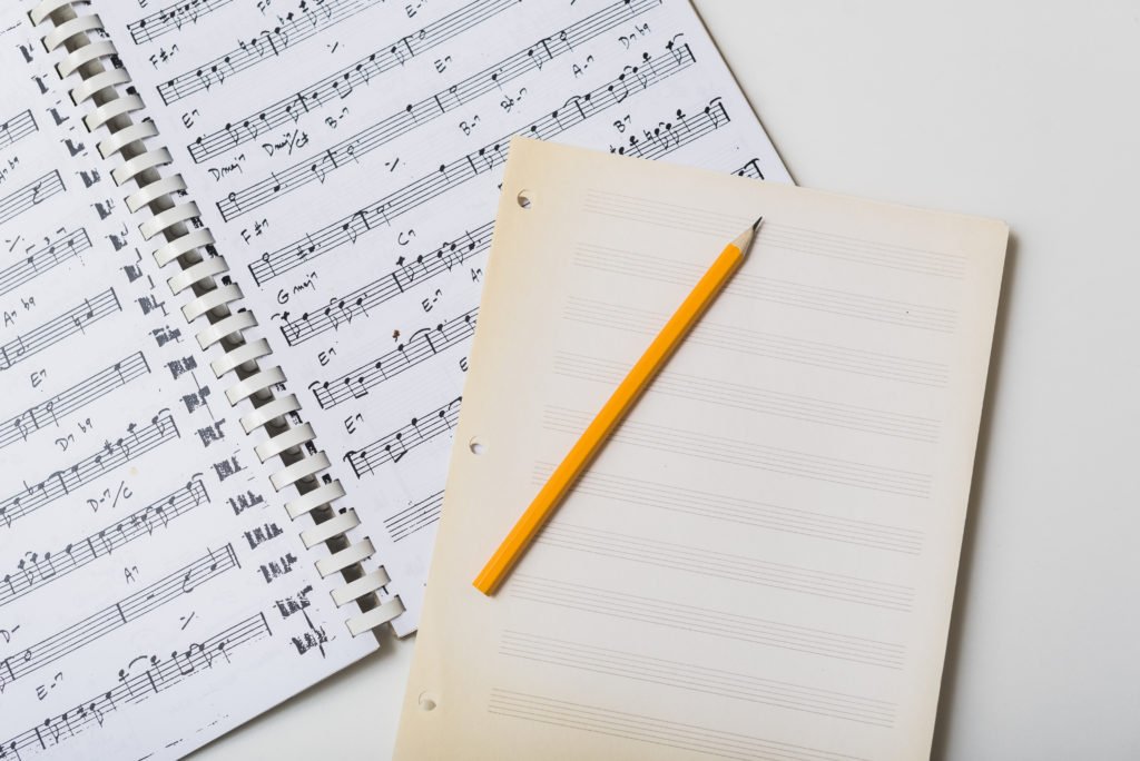 learning music theory, paper, pencil, sheet music