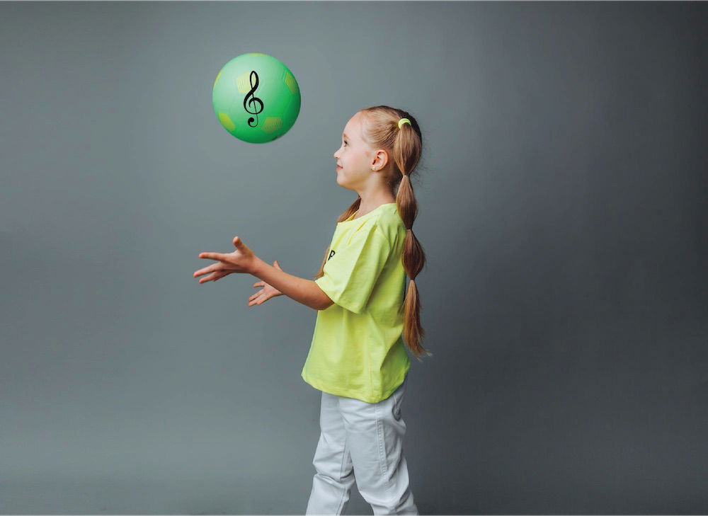 hot potato game, girl catching ball with treble clef on it