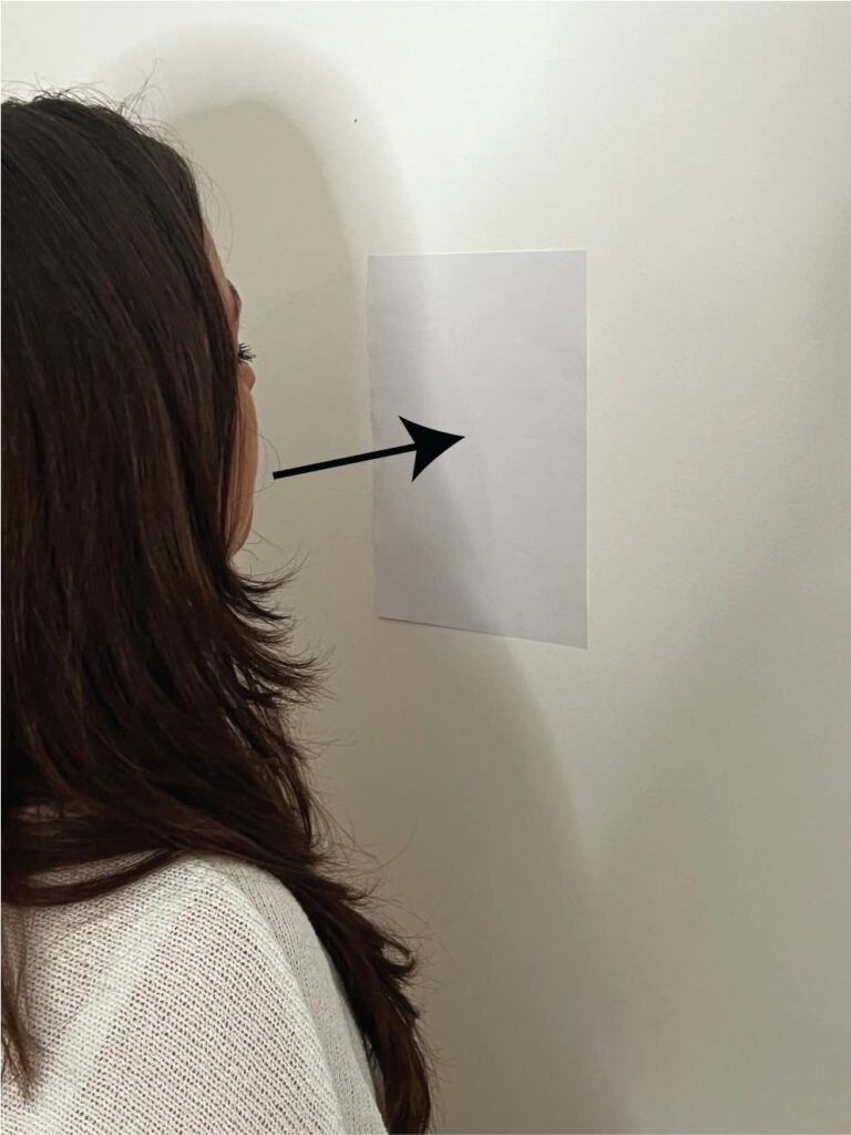 Blowing paper at wall copy