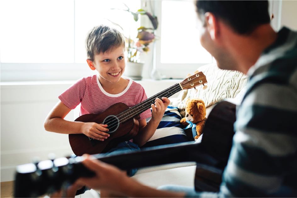 guitar-teacher-and-student-playing-guitar