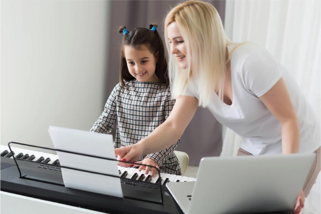 teacher-and-pupil-playing-piano